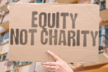 “Equity Not Charity” inequality with systemic solutions, not handouts. Protesters demand...