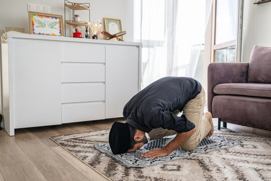 Muslim man praying at home 
