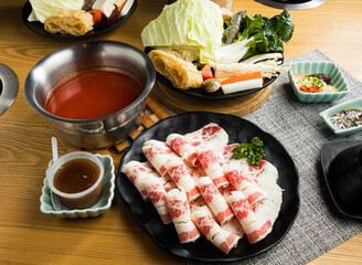 Bacon Beef Rolls for Hot Pot with Fresh Vegetables in broth side view of Asian food