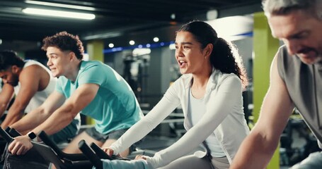 Fist bump, cycling class and group of people in gym for cardio workout, training or challenge together. Fitness, activity and athletes on stationery bicycle for spinning exercise in sports center.