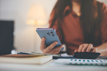 Fototapeta premium Portrait of young Hispanic professional business woman standing in office. Happy female company executive, smiling businesswoman entrepreneur corporate leader manager looking at camera using tablet