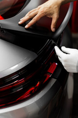 Manual vinyl cutting for perfect fitment and clean visual results. Vinyl Application in Progress in...
