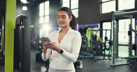 Phone, typing and smile with woman at gym for fitness app, workout schedule and communication. Networking, training guide and online exercise with person in sports club for connection, chat and web