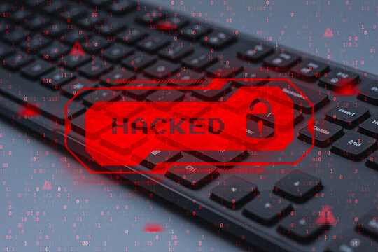 Cybersecurity breach warning with red HACKED alert on computer keyboard background. Concept of cyber attack with data breach, hacking, identity theft and internet security risk. - Powered by Adobe