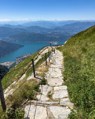 Hiking trail climbing up to Monte Generoso on the Switzerland-Italy border, offering a scenic...