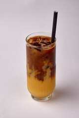 A Refreshing Layered Beverage of Iced Coffee Blended with Creamy Orange, Perfect for Quenching Thirst on a Hot Day with Its Unique Flavor Combination