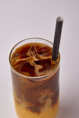 Deliciously Chilled Iced Coffee Beverage with Ice Cubes and a Straw Perfect for Refreshing Hot Days