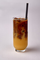A Refreshing Glass of Iced Coffee with Layers of Cream and Rich Brewed Coffee Perfect for Hot Days and Energizing Moments