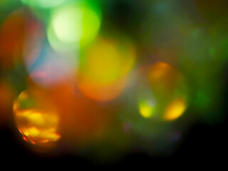 Colorful light leaks on black background for design and special effects. Retro film look. Abstract...