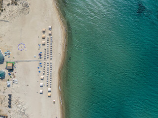 Aerial top-down view of a beautiful beach setup in Saros Gulf, Edirne, Turkey. Organized sun...