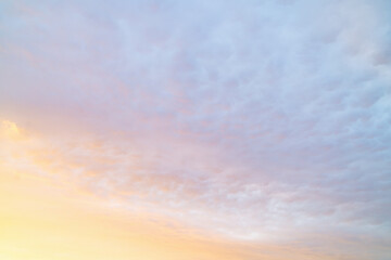 Beautiful twilight sky with soft clouds and pastel colors over the horizon during sunset
