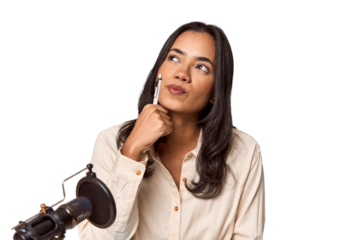 Filipino woman podcasting with mic and laptop