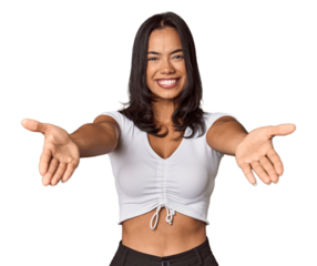 Young filipino woman showing a welcome expression.