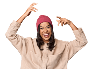 Joyful Filipino woman dancing in studio