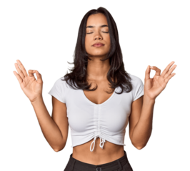 Young filipino woman relaxes after hard working day, she is performing yoga.