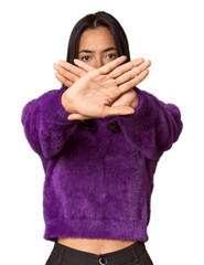 Young filipino woman doing a denial gesture
