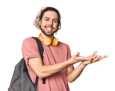 Young student with backpack and headphones holding a copy space on a palm.