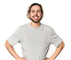 Young Caucasian man in studio setting confident keeping hands on hips.