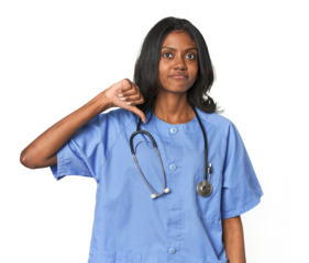 Young Indian nurse with stethoscope showing a dislike gesture, thumbs down. Disagreement concept.