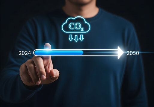 Man tracks carbon emissions progress from 2024 towards a cleaner 2050 future on futuristic display