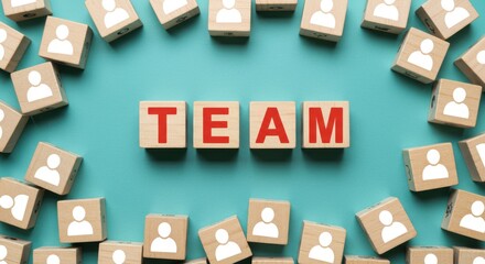 Naklejka premium Teamwork and Collaboration Concept with Wooden Blocks Spelling Out TEAM Surrounded by Cubes with Person Icons