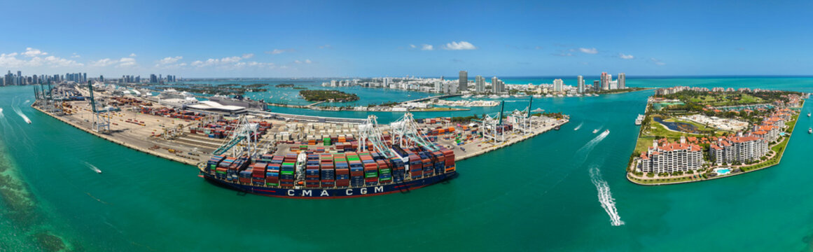 Miami, Florida, USA - April 20, 2025: CMA CGM cargo ship. Port of Miami. Cargo ship loaded with container in Miami, panorama. Aerial port panorama with cargo container. Panoramic Miami port