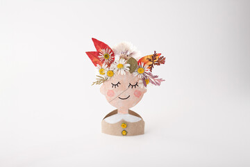 Folk inspired paper doll with floral crown made from recycled paper, perfect for children diy...