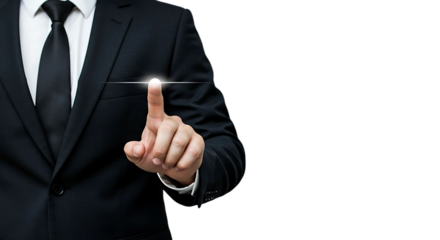 Businessman touching a glowing light on a black background