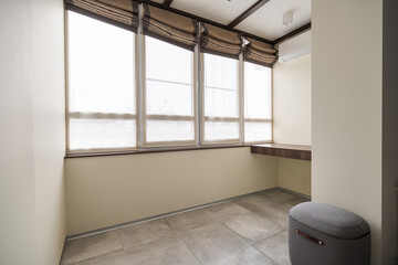 Natural light fills a minimalist corner office with large windows for an inspiring workspace