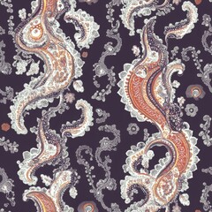 A pattern of paisley designs in purple and orange