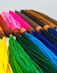 Colorful umbrellas, close-up view of handles and ribs