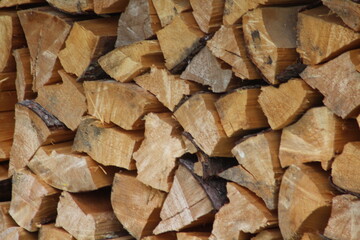 Chopped stacked wooden logs textured abstract background wallpaper 