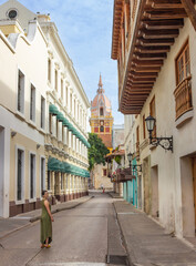 Tourist walking in cartagena enjoying colonial architecture