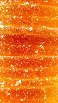 Close Up of Stacked Orange Sugar Candies with a Transparent Gelatin Texture