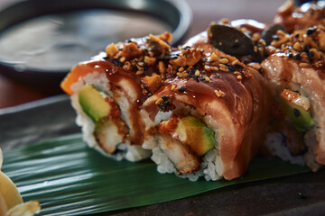 Delicious Gourmet Sushi Platter Featuring Fresh Ingredients, Creamy Avocado, Crispy Textures, and...