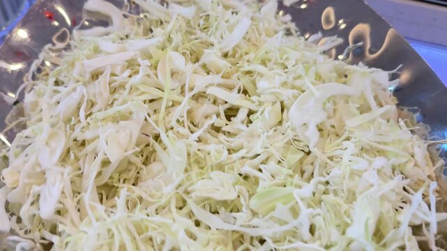 Coleslaw or cole slaw cabbage salad, a side dish consisting primarily of finely shredded raw cabbage, with a salad dressing or condiment, commonly either vinaigrette or mayonnaise, Netherlands origin