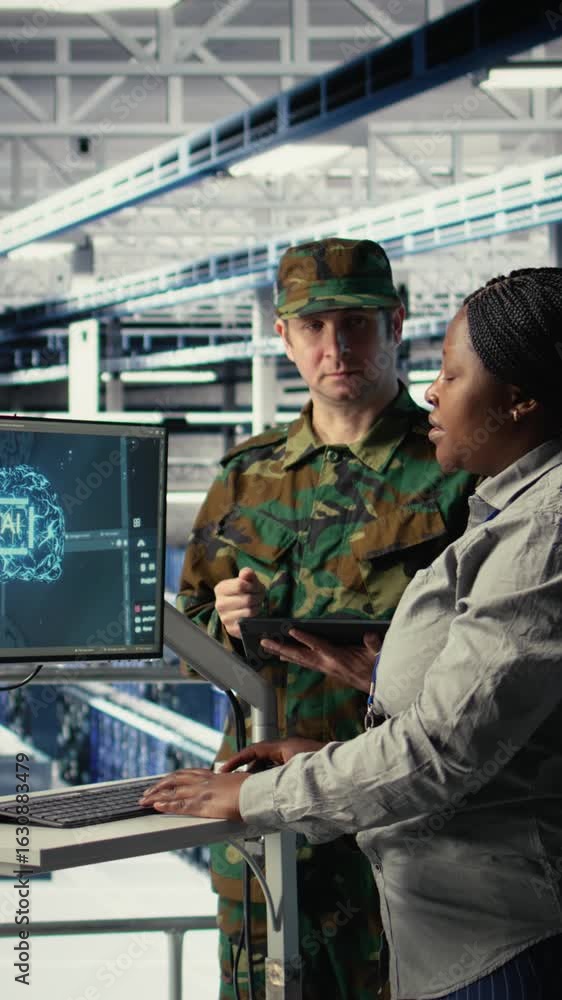 Poster vertical video army specialists in server room use advanced ai tools to review reconnaissance inform