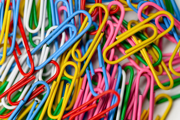Colorful Paper Clips in a Mixed Arrangement on a White Background