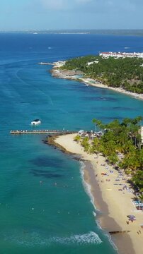 Dominicus beach at Bayahibe with Caribbean sea sandy seashore. Dominican Republic. Aerial view. Vertical footage