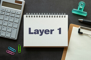 There is notebook with the word Layer 1. It is as an eye-catching image.