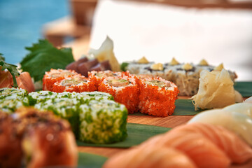 A Beautifully Arranged Platter of Delicious Sushi Featuring Various Types of Rolls, Fresh Ingredients, and Garnishes Perfect for Any Sushi Lover