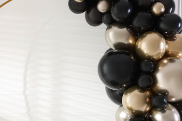 Stylish photo zone with balloons and decor in studio, closeup. Space for text