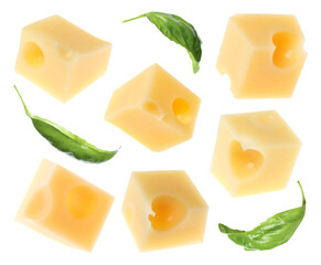 Cheese cubes and green basil leaves isolated on white, set
