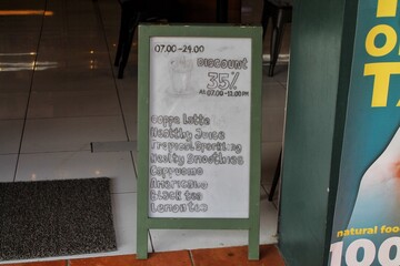 Cafe Menu Board Displaying Discounts and Listed Beverage Options