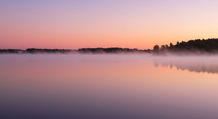 Obraz premium Misty Dawn Reflections on Lake: A serene landscape captures the gentle, ethereal beauty of dawn, as a tranquil lake mirrors the soft hues of the sunrise and the subtle wisps of morning mist.