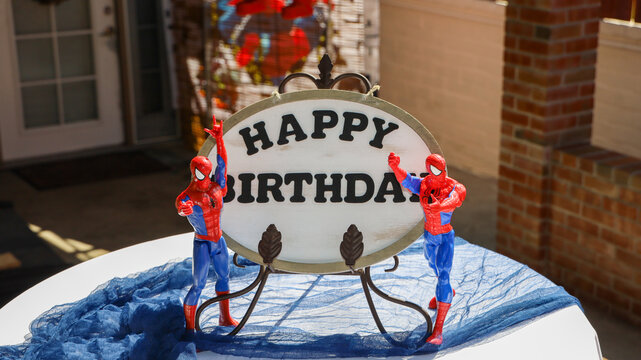 San Diego, CA USA on September 17, 2022. A Happy Birthday sign and Spiderman action figures on the sides for a Spiderman theme children's party.