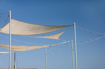 View of sale shades and outdoor string lights.