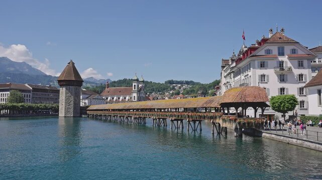 Chapel Bridge and Water Tower with Jesuit Church in Lucerne.Captured on July 15,2025.
