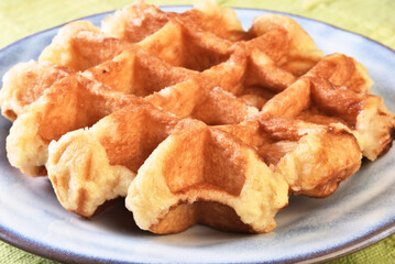 Traditional belgian waffles on a plate, close-up.   