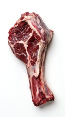 A raw leg of lamb cut, showing the bone and meat texture, isolated on a white background for food photography
